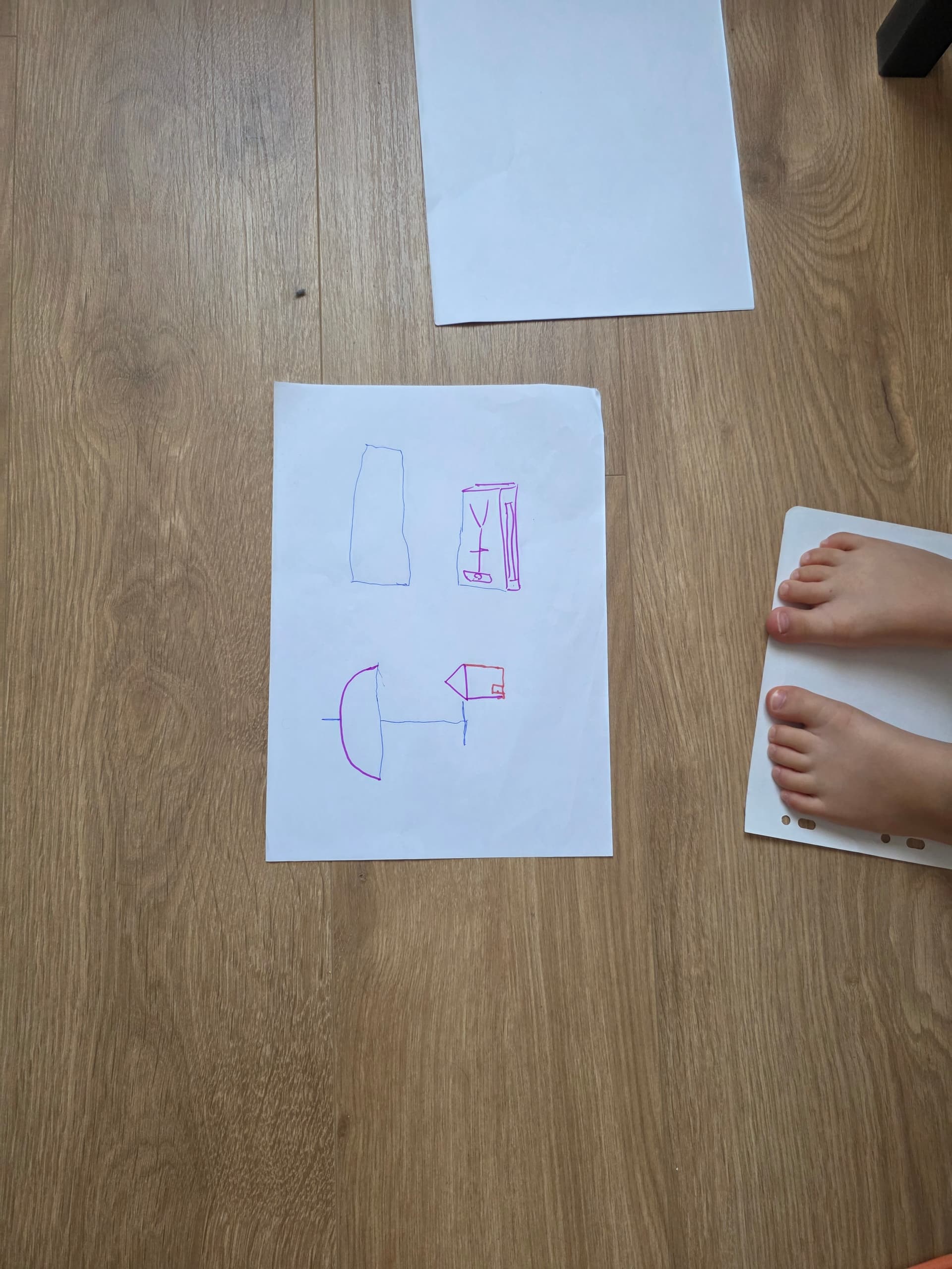 The shapes we each drew on our own side of the sheet: a suitcase, an upside-down lamp, a boat hull